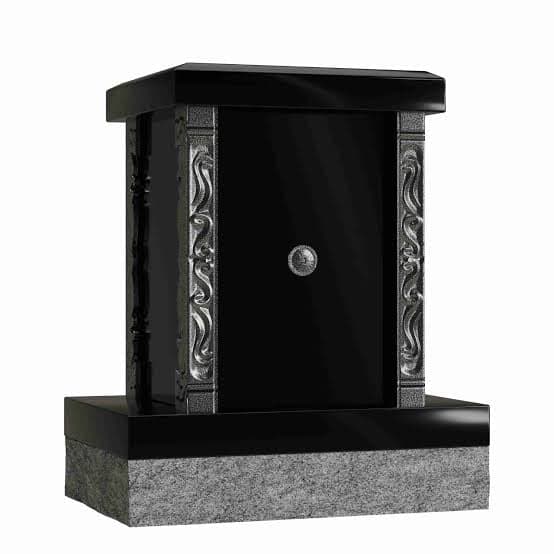 The personal columbarium: a black granite family unit with a glass-front niche, shown as supplied